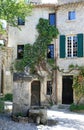 Romantic square with fountain in old french town Royalty Free Stock Photo