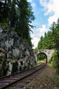 Romantic stone bridge over railway in beautiful forest, Czech republic