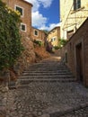 Romantic street in the picturesque small town Fornalutx, Majorca Spain, Mediterranean Sea Island. Royalty Free Stock Photo