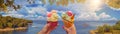 Romantic summer landscape panorama of a couple with bright sweet ice cream of different flavors in the hands and sea on background Royalty Free Stock Photo