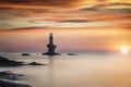 Romantic sunrise behind the famous Tourlitis lighthouse, Andros island, Greece Royalty Free Stock Photo