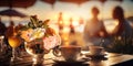 romantic sunset beach at sea caffee cafe ,cup of coffee ,sweet cake and flowers on table ,romantic couple relaxing, Royalty Free Stock Photo