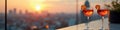 Romantic sunset cityscape with cocktails on rooftop bar terrace Royalty Free Stock Photo