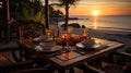 Romantic sunset dinner on the beach. AI Generated Royalty Free Stock Photo