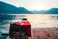 Romantic sunset dinner on the beach. Summer love, romance date on vacation concept. Royalty Free Stock Photo