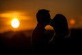 Romantic sunset kiss