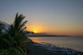 Romantic sunset on a tropical beach with palm trees. Sunset on the beach with beautiful sky. Sunrise on the beach.Beautiful sunset Royalty Free Stock Photo