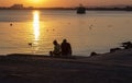 Romantic sunset with two lovers on the beach