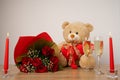 Romantic surprise with candles, roses and toy