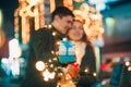 Romantic surprise for Christmas, woman receives a gift from her boyfriend Royalty Free Stock Photo