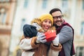 Romantic surprise for Christmas. Couple with present outdoor Royalty Free Stock Photo