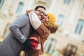 Romantic surprise for Christmas. Couple with present outdoor Royalty Free Stock Photo