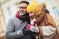 Romantic surprise for Christmas. Couple with present outdoor Royalty Free Stock Photo