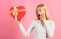 Romantic surprise gift for her. Heart melting valentines day gifts that every girl wants. Woman hold heart shaped gift