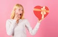 Romantic surprise gift for her. Heart melting valentines day gifts that every girl wants. Woman hold heart shaped gift Royalty Free Stock Photo