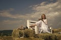 Romantic sweet holiday day and luxury girl. Woman reading book on bench on blue sky Royalty Free Stock Photo