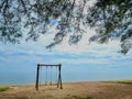 Romantic swings in Samila beach Thailand watching in the morning Royalty Free Stock Photo