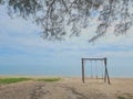Romantic swings in Samila beach Thailand watching in the morning Royalty Free Stock Photo