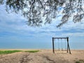 Romantic swings in Samila beach Thailand watching in the morning Royalty Free Stock Photo