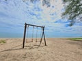 Romantic swings in Samila beach Thailand watching in the morning Royalty Free Stock Photo
