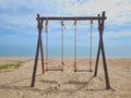 Romantic swings in Samila beach Thailand watching in the morning Royalty Free Stock Photo