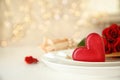 Romantic table setting against blurred lights, space for text. Valentine`s day celebration Royalty Free Stock Photo