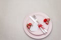 Romantic table setting on light stone concrete background. Valentine`s day or Wedding card template. Paper heart, flowers, cutler Royalty Free Stock Photo