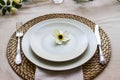 Romantic table setting for two with a flowers. Shallow depth of field. Royalty Free Stock Photo