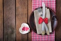 Romantic table setting for Valentines day in a rustic style. Royalty Free Stock Photo