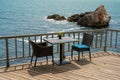 Romantic table for two people on a terrace by the sea Royalty Free Stock Photo