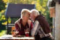 Romantic talk of senior couple in garden Royalty Free Stock Photo