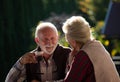 Romantic talk of senior couple in garden Royalty Free Stock Photo