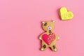 Romantic Teddy bear, gingerbread heart on trendy pink background.