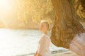 Romantic teen girl listening to music with headphones and enjoying sunset Royalty Free Stock Photo