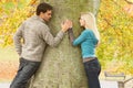 Romantic Teenage Couple By Tree