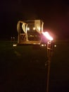 Romantic terrace with torches in a field