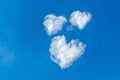 Romantic three clouds in the shape of a heart on a blue sky. Love concept Royalty Free Stock Photo