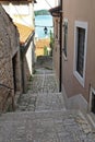 Romantic travel location, picturesque paved old narrow stone street in the Old Town of Rovinj, Croatia. Europe Royalty Free Stock Photo