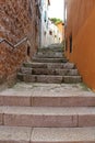 Romantic travel location, picturesque paved old narrow stone street in the Old Town of Rovinj, Croatia. Europe Royalty Free Stock Photo