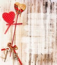 Romantic valentine background. Hearts on wood.