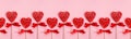 Romantic valentine`s day banner - sweet red lollipops hearts on pastel pink color as seamless border, layout for design.