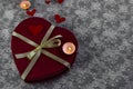 A romantic valentine`s day card. Big red gift box in the form of a heart with a yellow ribbon bow on a white background, candle, Royalty Free Stock Photo