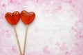 Romantic Valentine`s day background. Lollipops in the shape of heart close up isolated on white background. Royalty Free Stock Photo