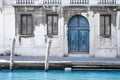 Romantic Venetian nook with vintage blue wooden door and windows