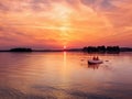 Romantic vibrant sunset river lake fog loving couple small rowing boat date beautiful Lovers ride during Happy woman man Royalty Free Stock Photo