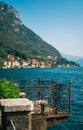 Romantic view of the terrace overlooking Lake Como and Bellagio town in the background, Italy. Royalty Free Stock Photo
