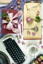 Romantic vintage feminine writing desk stop motion with old typewriter. Royalty Free Stock Photo