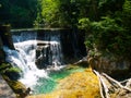 Romantic waterfall with clear blue water in Vintgar Gorge, Radovna River in Julian Alps, Slovenia, Europe