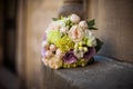 Romantic wedding bouquet, pink, purple and white roses on a stone closeup Royalty Free Stock Photo