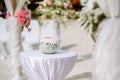 Romantic wedding ceremony on the beach. Wedding setting on the beach. Flowers wedding ceremony by the sea.